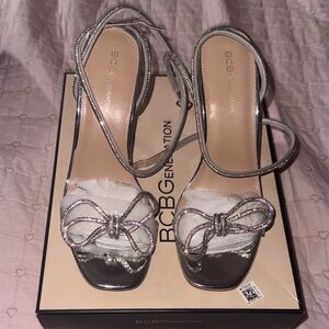 BCBGeneration Metallic Silver Heels with Bow Accent